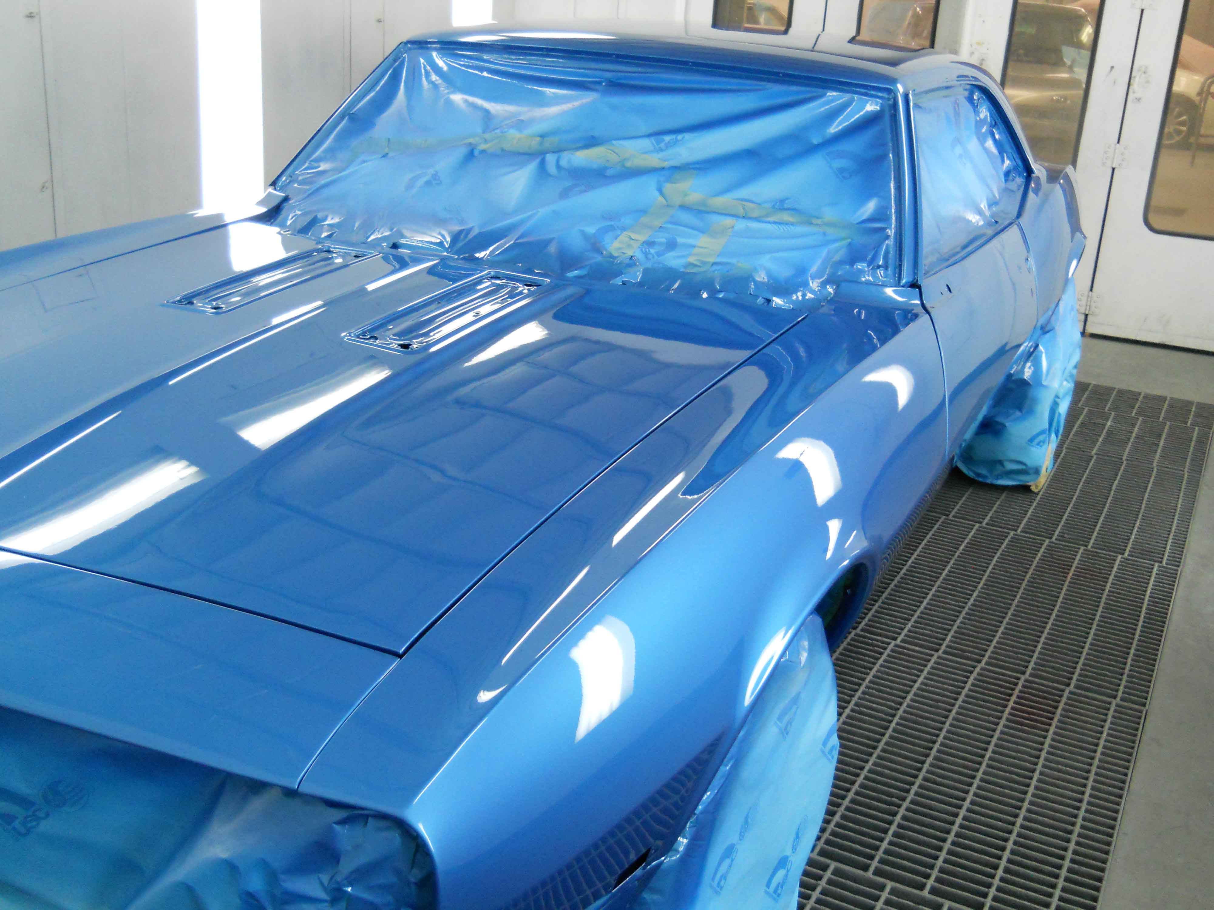 blue car being painted